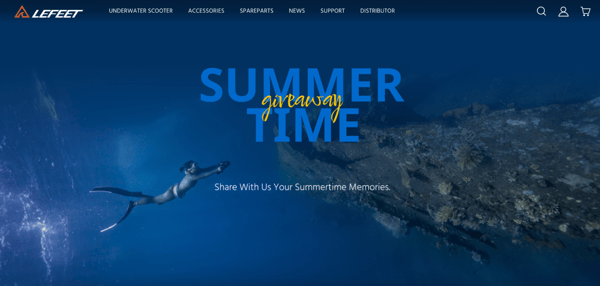 Screenshot shows LEFEET's home page, where it says, Summertime Giveaway: share with us your summer memories. In the background of the webpage, there is a picture of a person diving and holding a camera towards a rock formation.