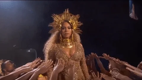 A gif of singer Beyoncé wearing a crown and a golden suit in the middle of her dancers praising her as a goddess, representing your customers when you have a specific unique selling proposition.